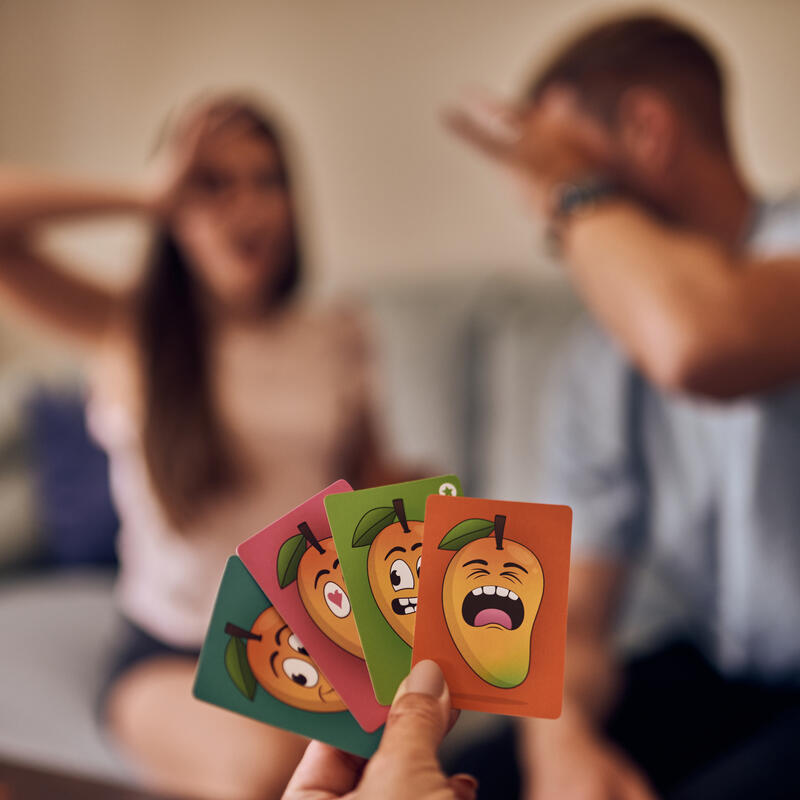 Mango game lifestyle image showing cards in hand