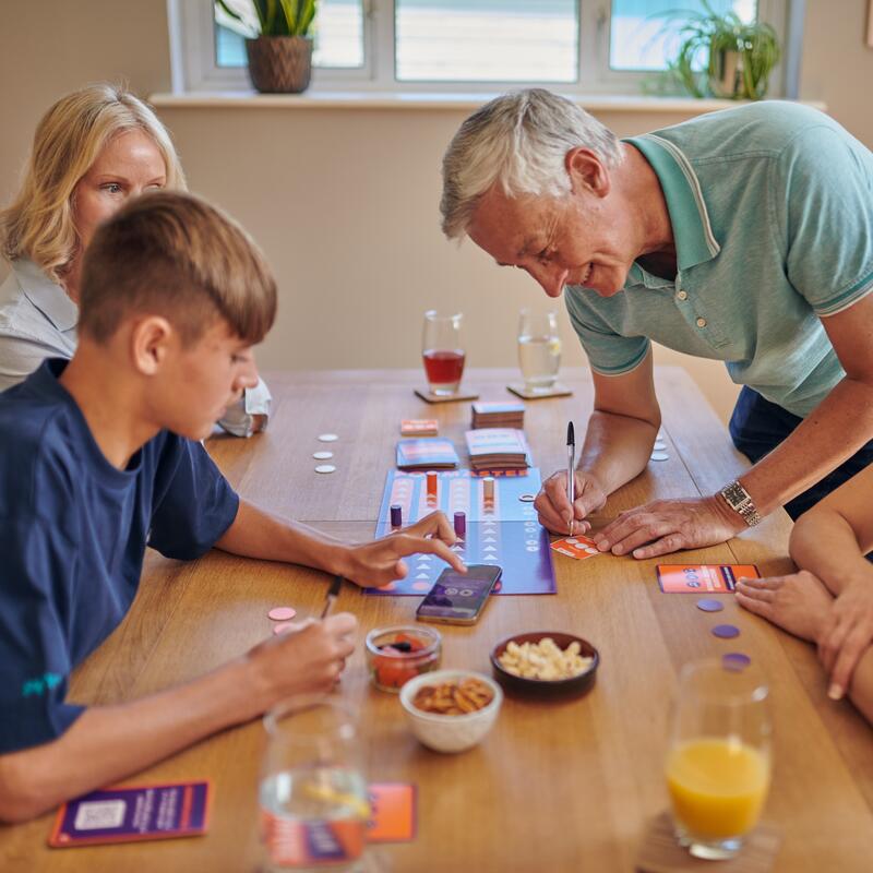 Popmaster board game lifestyle image people using digital content