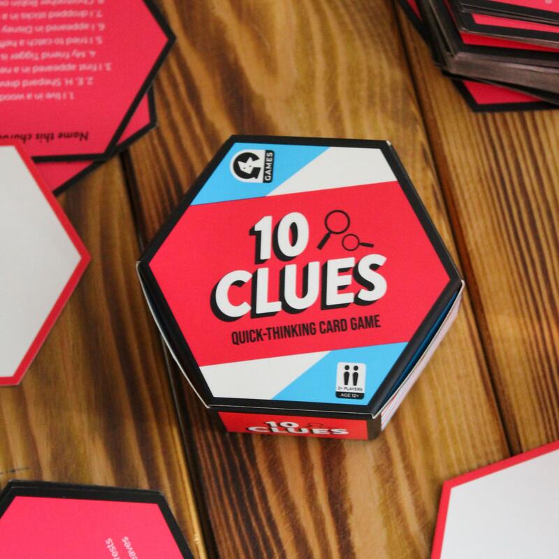 Ginger Fox 10 Clues travel-sized family card game on a wooden table