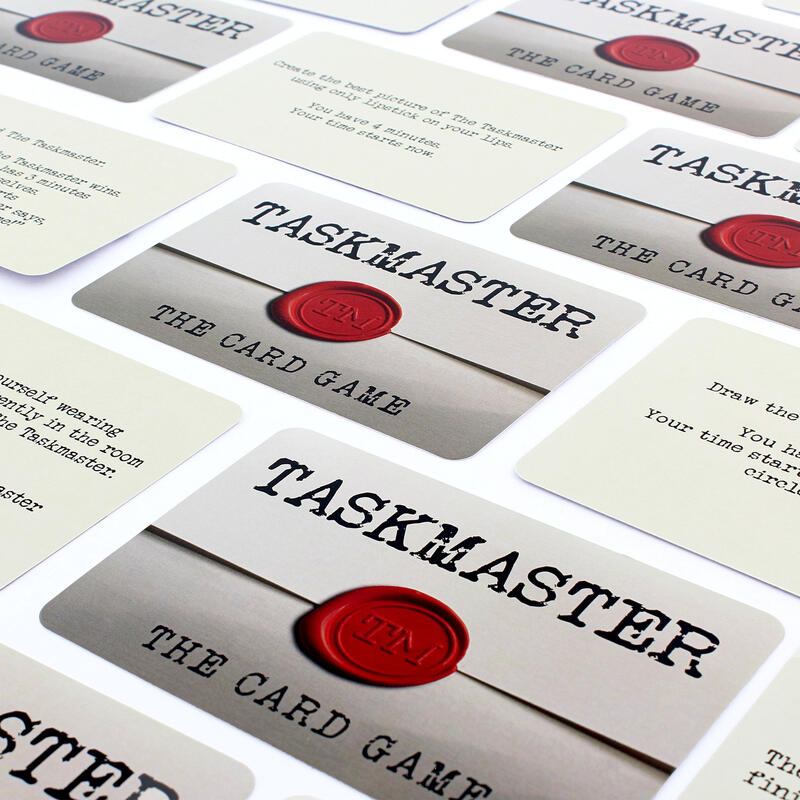 Tasmaster card game cards laid flat on white background